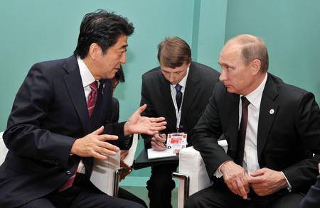 Japan’s Abe ducks West’s sanctions, sets meetings with Putin