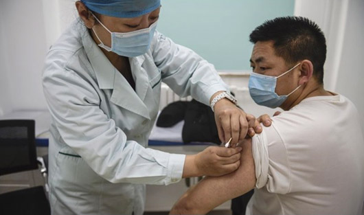 China, in reversal, prioritizes vaccine access for 18-59 age group