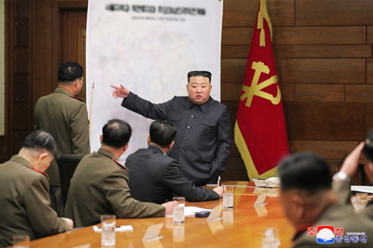 Kim conducts war planning session, halts daily hotline calls with South